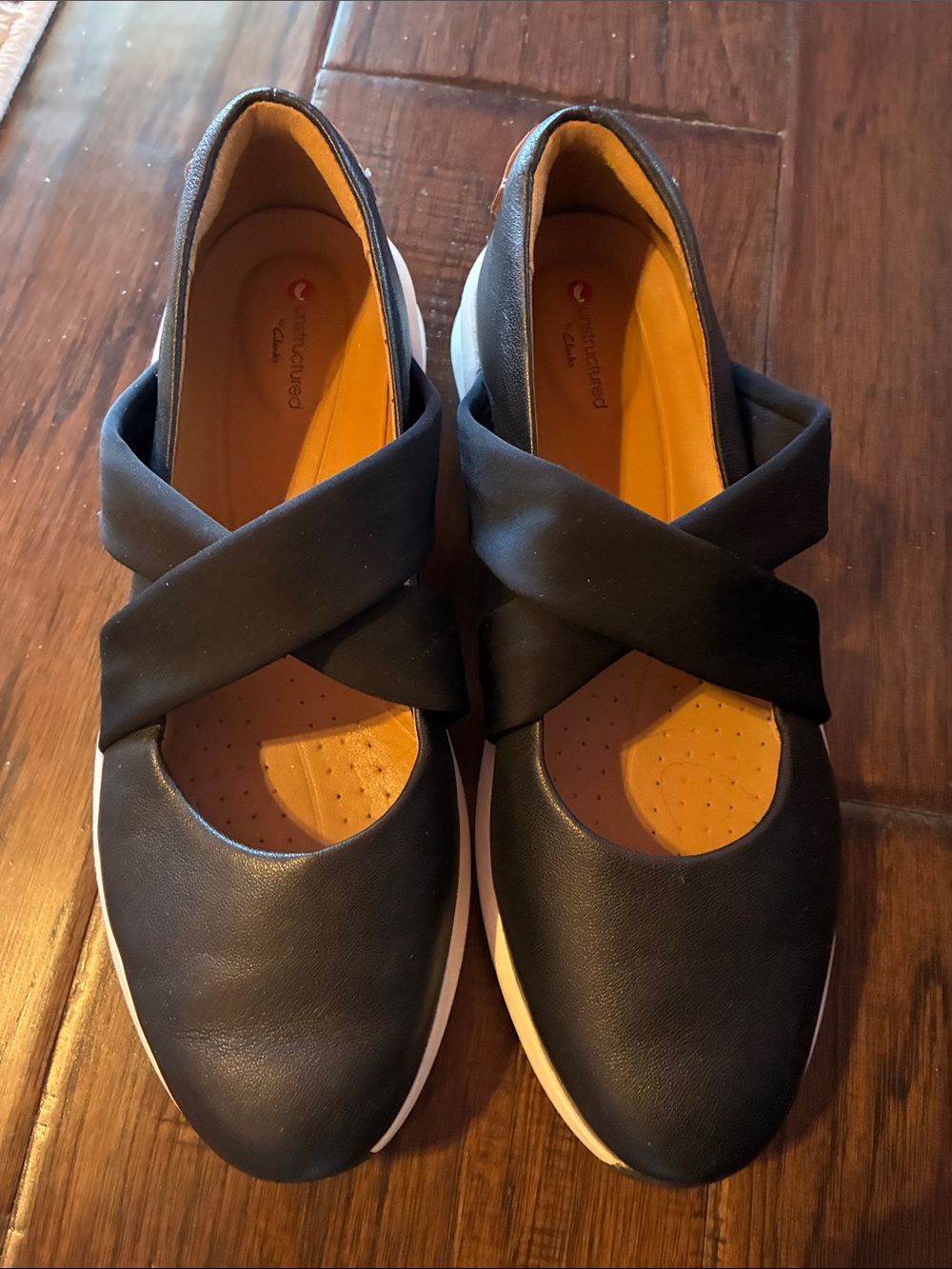 Clarks Black Cross-Strap Slip-On Flats with Orange Insole